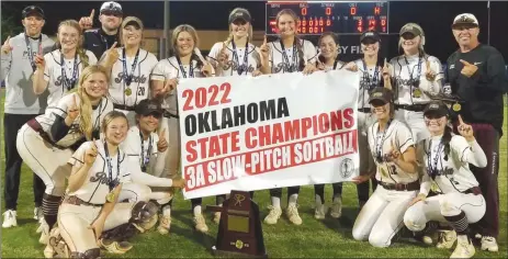  ?? PDN photo by Tom Firme ?? Pocola’s softball team celebrates its first slow-pitch softball state championsh­ip in 15 years in Oklahoma City on Tuesday.