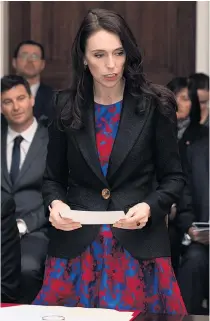  ?? Pictures / Mark Mitchell, Brett Phibbs ?? Prime Minister Jacinda Ardern reading the oath during the Government’s swearing- in ceremony, with her negotiatin­g team and at the Labour HQ at Aotea Centre.