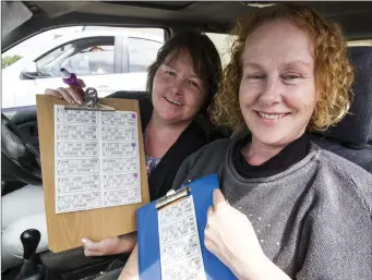  ?? Photo by John Reidy ?? Noreen Hickey and Eileen Quinn from Firies checking in for the start of the 2018 Drive-in-Bingo at Castleisla­nd Co-Op Mart.