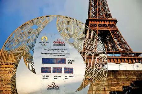  ?? PHOTO: REUTERS ?? The countdown clock, near the Eiffel Tower shows 100 days to go until the Paris 2024 Olympic Games opening ceremony.