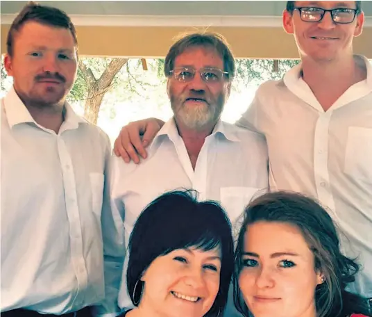  ??  ?? Seen with his family in happier times, Frik Roodt was shot and killed in a home invasion on Sunday