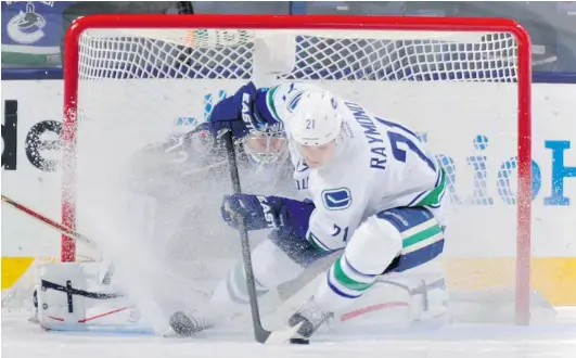  ?? JAMIE SABAU/ NHLI VIA GETTY IMAGES ?? Canuck Mason Raymond stops and spins in front of Blue Jackets goaltender Sergei Bobrovsky before scoring the game- winning shootout goal on Tuesday in Columbus.