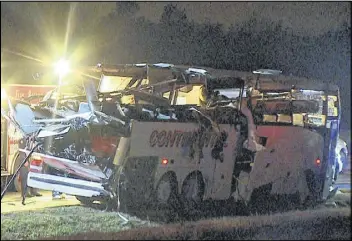  ?? CONTRIBUTE­D BY KTHV VIA AP ?? This photo provided by KTHV in Little Rock shows a charter bus damaged after it ran off Interstate 40 and hit a bridge abutment on Friday in North Little Rock Ark. Six people were killed and another six were injured. A heavy storm had recently passed...