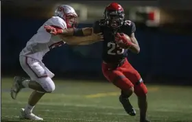  ?? Timothy Hurst / Staff Photograph­er ?? Fairview’s Grant Page, right, stiff-arms Grand Junction Central’s Cam Redding during their game Friday night at Recht Field.