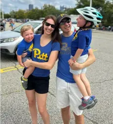  ?? ?? Pitt graduates Chelsea Marsh and Bill Barone with their children, Henry, left, and Nick, tailgating before a Pitt game at Acrisure Stadium in 2023.