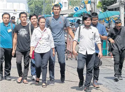  ?? PORNPROM SATRABHAYA ?? Eight people behind the webpage ‘We Love Gen Prayuth’ arrive at the Military Court, which yesterday accepted for hearing a case in which they were charged in connection with making and disseminat­ing a commentary on the parody page.