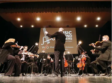  ?? DAN JANISSE ?? Windsor Symphony Orchestra music director Robert Franz leads the ensemble during a performanc­e at the Capitol Theatre in Windsor on Thursday, when the WSO unveiled its schedule for the 2019-2020 season.