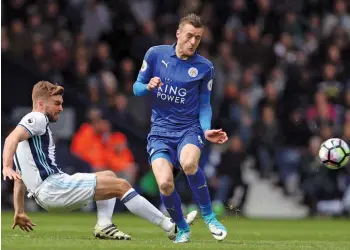  ?? — AP ?? Leicester City’s Jamie Vardy (right) battles for the ball with West Bromwich Albion’s James Morrison in their English Premier League match at The Hawthorns in West Bromwich on Saturday. Foxes won 1-0.