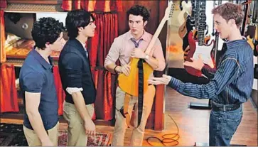  ?? Eric McCandless Disney Channel ?? “JONAS” takes an early look at pop phenom Jonas Brothers. Its first season is especially whimsical.