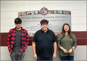  ?? (NWA Democrat-Gazette/Spencer Bailey) ?? Students Aum Modi (from left), Carlos Zamora and Joy Nam received their alumni pins for the Arkansas Governor’s School on Feb. 9 during the School Board meeting in Siloam Springs. The Arkansas Governor’s School is a statewide summer residentia­l program for incoming high school seniors who want to further explore their passions.