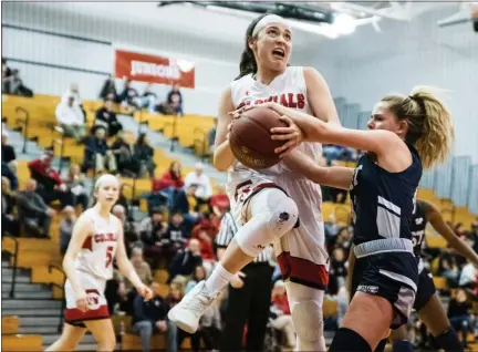  ?? JAMES BEAVER/FOR MEDIANEWS GROUP ?? Plymouth Whitemarsh’s Anna McTamney (32) attempts to get a shot off but is halted by Pocono Mountain West’s Caroline Weirich (5) in the state tournament last season.