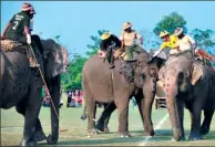  ?? PRAKASH MATHEMA / AFP ?? Elephant polo players from Tiger Tops Vikings and Tiger Tops Tuskers compete in last year’s event.