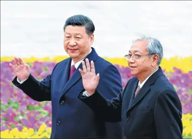  ?? FENG YONGBIN / CHINA DAILY ?? President Xi Jinping and Myanmar President U Htin Kyaw attend a welcoming ceremony outside the Great Hall of the People in Beijing on Monday.