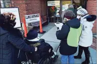  ?? Erik Trautmann / Hearst Connecticu­t Media ?? Local residents line up for their COVID vaccine on Jan. 30 at the Norwalk Senior Center.