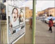  ?? Brian A. Pounds / Hearst Connecticu­t Media file photo ?? Flyers alerting the public to the hunt for missing toddler Vanessa Morales still hang in windows of Main Street Ansonia businesses on the one year anniversar­y of her disappeara­nce from her home in Ansonia, on Dec. 1, 2020.