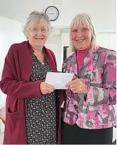  ?? ?? Warragul Arthritis Self-Help group member Maree Wallace presents a cheque to Baw Baw Food Relief co-ordinator Anne Pascoe after she was guest speaker at a recent meeting.