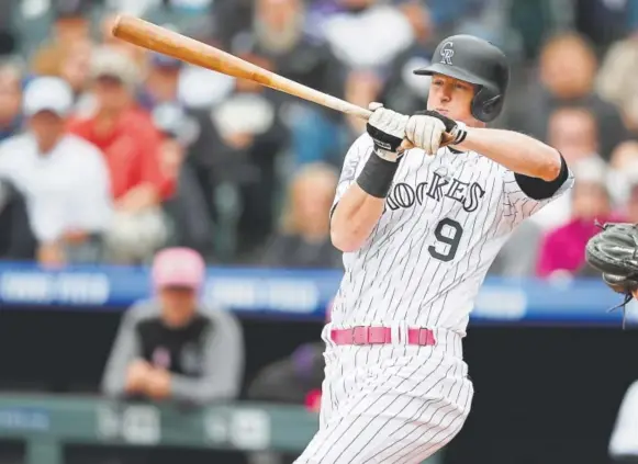  ?? David Zalubowski, The Associated Press ?? It seems no one is immune from the Rockies’ recent difficulti­es trying to put the ball in play — not even DJ LeMahieu, who struck out three times Sunday against the Brewers, including on a check swing, above. LeMahieu, the 2016 National League batting...