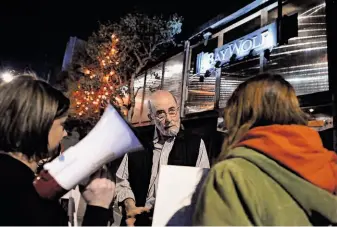  ?? Michael Short / Special to The Chronicle ?? Baywolf owner Larry Goldman meets with protesters during the restaurant’s Farewell to Foie Gras dinner. Activists say force-feeding ducks and geese for foie gras is inhumane.