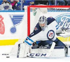  ?? BILLY HURST/THE ASSOCIATED PRESS ?? Winnipeg’s Connor Hellebuyck has been getting extra days of rest down the stretch as the team tries to manage his workload heading into his first playoff appearance.