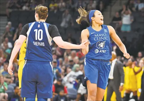  ?? Sam Wasson / Getty Images ?? The Minnesota Lynx’s Napheesa Collier, right, celebrates with teammate Jessica Shepard against the Los Angeles Sparks on Saturday.