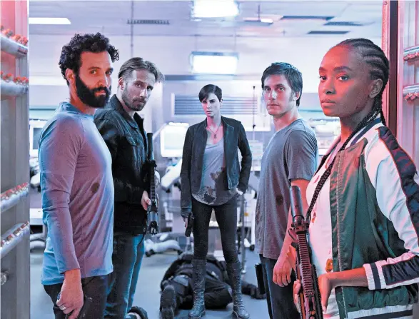  ?? AIMEE SPINKS/NETFLIX ?? Marwan Kenzari, from left, Matthias Schoenaert­s, Charlize Theron, Luca Marinelli and Kiki Layne in “The Old Guard,” directed by Gina Prince-Bythewood.
MPAA rating: R (for sequences of graphic violence, and language)
Running time: 1:58
Streaming: Netflix