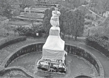  ?? GENE J. PUSKAR/AP ?? A statue of Christophe­r Columbus in Pittsburgh, which was wrapped to protect it from vandalism ahead of Columbus Day in October, remained in a protective covering on Thanksgivi­ng Day.