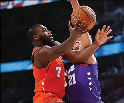  ?? JONATHAN DANIEL — GETTY IMAGES ?? The Warriors’ Eric Paschall of Team USA drives against Moritz Wagner of the World team during Friday’s Rising Stars Challenge.