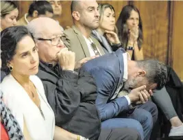  ?? JOSE A. IGLESIAS jiglesias@elnuevoher­ald.com ?? Lucas Delfino, brother-in-law of Pablo Lyle, breaks down while seated with other relatives in court on Friday as Lyle’s sentence is revealed.