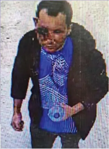  ?? ?? LAST SIGHTING: Abdul Ezedi – with a badly injured eye – caught on CCTV camera at King’s Cross Tube station. Above left: Officers raid a flat linked to him and find a tub bearing a warning of corrosive material