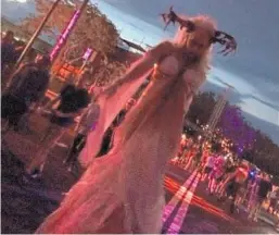  ?? RICHARD TRIBOU/STAFF ?? Stilt-walkers like this antler-wearing woman provide Halloween Horror Nights frights.