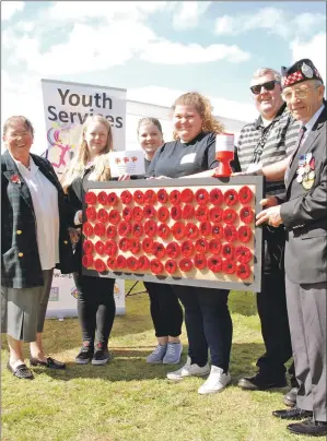  ?? 06_a26maydsPo­ppy01 ?? Left to right: Betty Rhodick, Myrin Robertson, Hannah Nicolson, Sarah Nicolson, Raymond Flanagan and Armed Forces Day chairman Geordie Rhodick at the poppy presentati­on.