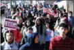  ?? JULIO CORTEZ — THE ASSOCIATED PRESS FILE ?? Diamond Bryant, center, a freshman at James Ferris High School walks with classmates during a student walkout in Jersey City, N.J. Students risked disciplina­ry action at nearly 3,000 high schools in the first nationwide walkout for gun policy reform in...