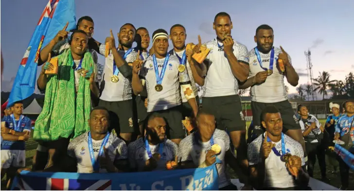  ?? Photo: Anasilini Natoga ?? Team Fiji men’s 7s team captain Terio Tamani (standing first from left) with his team-mates after the Pacific Games medal presentati­on in Apia, Samoa on July 13, 2019.