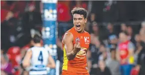  ??  ?? Suns player Callum Ah Chee reacts after kicking a goal during the Round 7 match against Geelong. Picture: DAVE HUNT