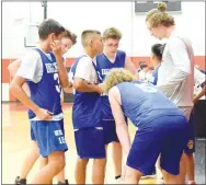  ?? Westside Eagle Observer/MIKE ECKELS ?? Dayton Shaw (upper right) tries a new game plan during the short break of the Decatur-St. Vincent junior high contest.