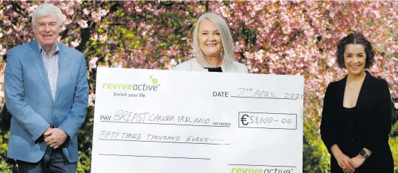  ??  ?? Daithi O’Connor, founder and MD of Revive Active, and Andra Rooney, area manager, presenting a cheque for €53,000 to Aisling Hurley, CEO of Breast Cancer Ireland, following a successful fundraisin­g drive over Christmas by the Super Supplement brand to raise funds to support pioneering research and awareness campaigns in 2021 by Breast Cancer Ireland. The funds were raised through the sales of limited edition Revive Active Immunity Support Gift Packs sold across Ireland over the Christmas period, with 100% of all proceeds going to Breast Cancer Ireland. Aisling Hurley, CEO of Breast Cancer Ireland, said: “We are delighted to have been selected as the beneficiar­y of this fundraisin­g initiative, and extremely grateful to all of those who bought the special Revive Active packs, indirectly raising funds to help us realise the ultimate mission of Breast Cancer Ireland, which is to increase the speed of research discovery thus turning breast cancer into a treatable illness which can be managed and cured in the long-term.”