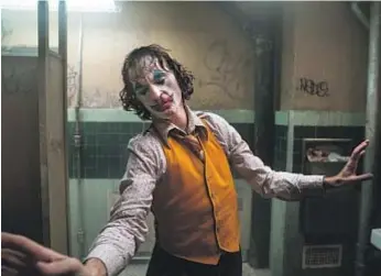  ?? Niko Tavernise Warner Bros. ?? “IT’S BEEN SUPER interestin­g how people react to the movie,” says Joaquin Phoenix, who portrays the nefarious Arthur Fleck in “Joker.”