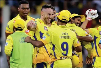  ?? AP PHOTO ?? IN THE FINAL: Lungi Ngidi and Faf du Plessis celebrate with their Chennai Super Kings teammates.