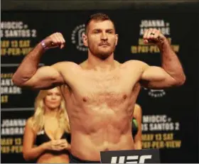  ?? TIM PHILLIS — THE NEWS-HERALD ?? Stipe Miocic poses during his weigh-in for UFC 211 on May 12 in Dallas.