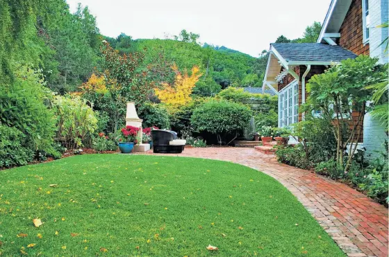  ?? Jay Caldwell ?? The backyard of this four-bedroom Marin Avenue home includes a brick walkway in an area large enough for children to play.