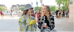  ?? | Netflix ?? EMILY (Lily Collins) and Petra (Daria Panchenko) in the now controvers­ial shopliftin­g scene on Emily In Paris.