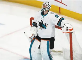  ?? David Zalubowski / Associated Press ?? Sharks goalie Martin Jones stopped 25 shots, but was outdone by Colorado’s Philipp Grubauer, who made 32 saves for his first career postseason shutout.