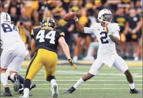  ?? Matthew Putney / Associated Press ?? Penn State quarterbac­k Ta’Quan Roberson looks to pass during the second half against Iowa on Oct. 9. Roberson is transferri­ng to UConn.