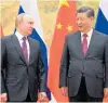  ?? ?? Vladimir Putin and Xi Jinping. Photo / AP