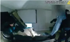  ?? — AFP photo ?? Screen grab taken from Minneapoli­s Police Department body camera footage shows police pointing their guns at Locke as he lies on a sofa under a blanket before being shot by police.