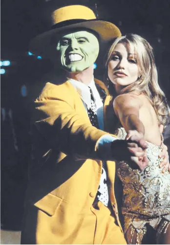  ?? GETTY ?? Jim Carrey and Cameron Diaz starred in “The Mask.” The 1994 film, directed by Chuck Russell, turned Carrey into a superstar. The movie earned $351 million worldwide.