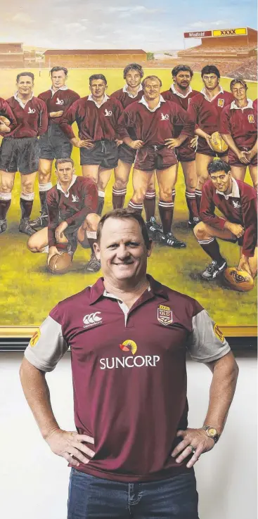  ??  ?? NEW REIGN: Kevin Walters, standing in front of a painting of the Team of the Century at Suncorp Stadium, has been named as Maroons coach for the next three years.