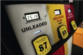 ?? JOHN BAZEMORE — THE ASSOCIATED PRESS FILE ?? Gas pumps are shown Dec. 2022, in Madison, Ga. Drivers in the U.S. and Europe are getting a break from the record-high pump prices they endured over the summer. But that price tag is still difficult for many customers who have been enduring relentless inflation and were used to lower prices.