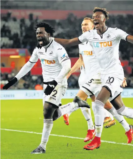  ??  ?? > Wilfried Bony roars his approval after scoring the winner against West Brom on Saturday. He’ll need little in the way of motivation for tomorrow’s clash with his old club Manchester City