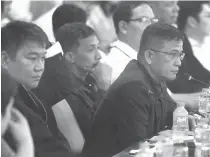  ?? PHOTO BY RUY L. MARTINEZ ?? EMBATTLED
Customs Commission­er Nicanor Faeldon ( right) testifies before an inquiry into the alleged smuggling of illegal drugs from China on Wednesday at the House of Representa­tives.